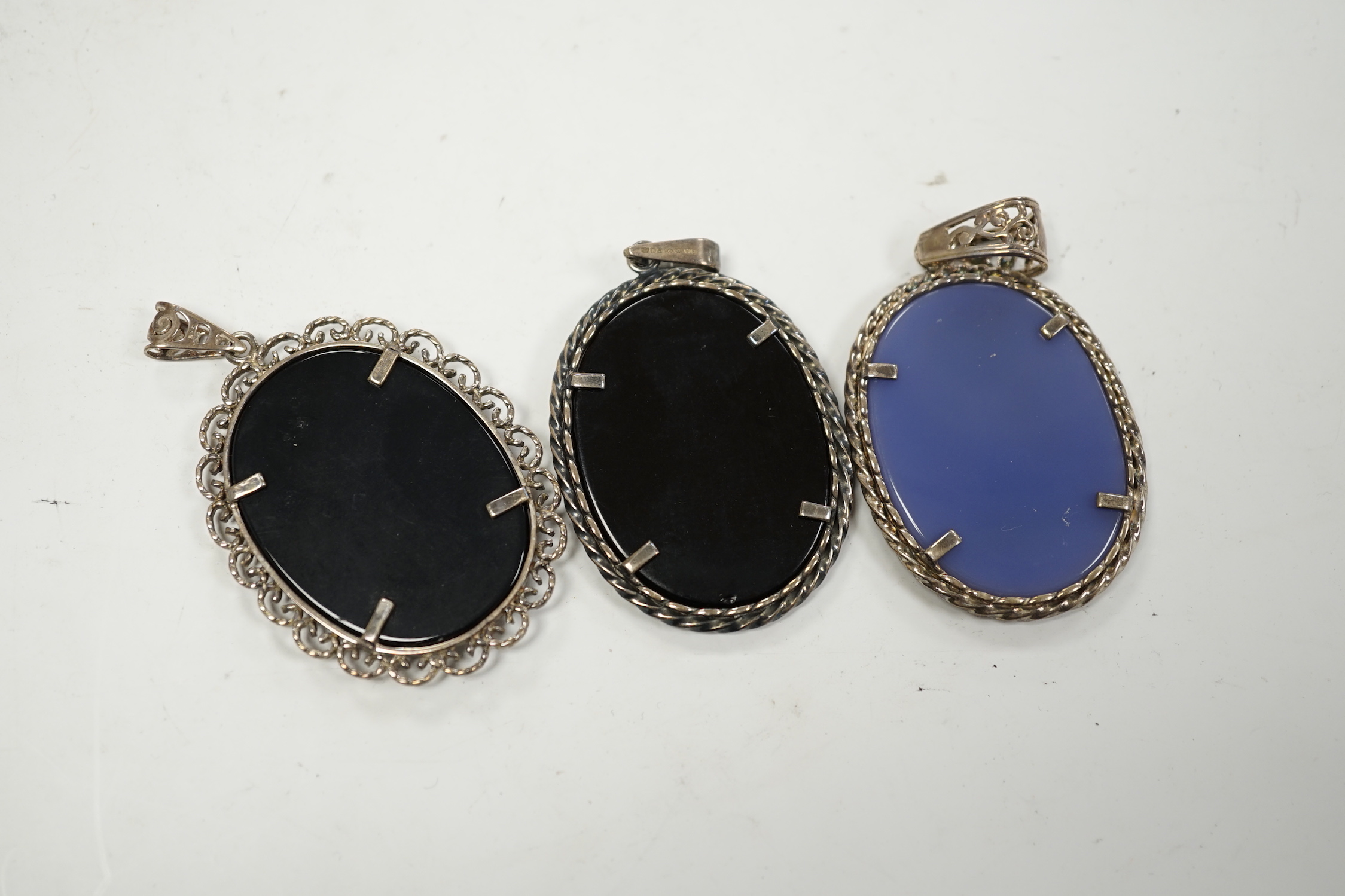Three modern 925 or silver mounted Wedgwood style oval plaque pendants, 42mm.